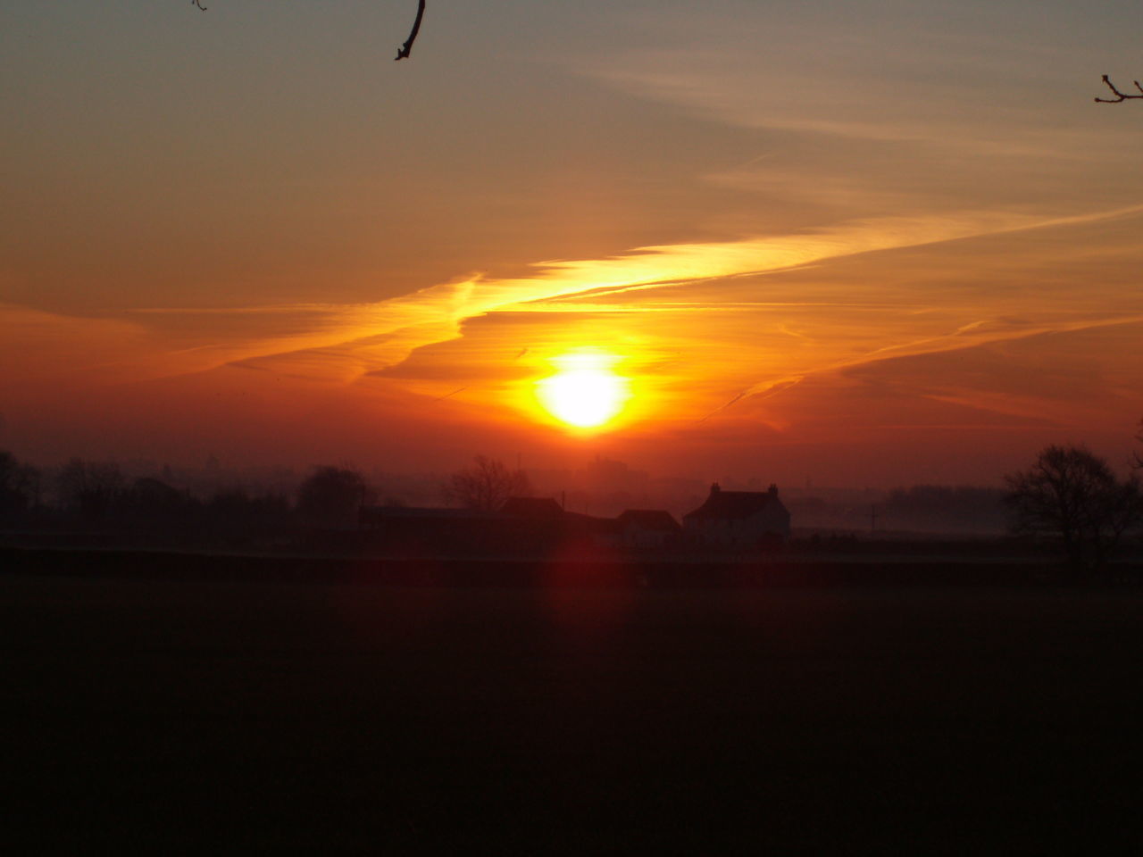 SCENIC VIEW OF SILHOUETTE LANDSCAPE AGAINST ORANGE SKY