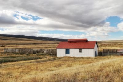 House on field against sky