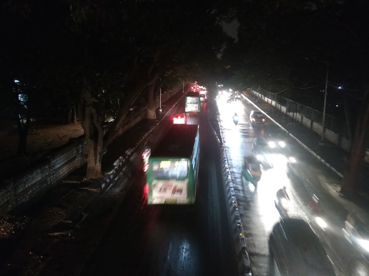 HIGH ANGLE VIEW OF CARS ON STREET AT NIGHT