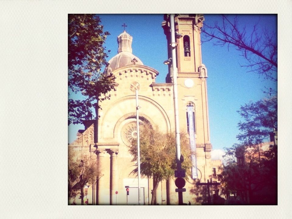 architecture, built structure, place of worship, religion, church, building exterior, spirituality, low angle view, cross, transfer print, tree, clear sky, blue, auto post production filter, cathedral, sky, dome, day