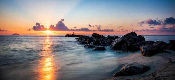 Scenic view of sea against sky during sunset