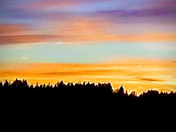 View of silhouette landscape against sky