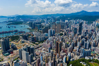 High angle view of modern buildings in city against sky