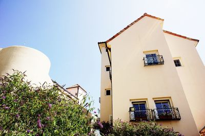 Low angle view of building against clear blue sky