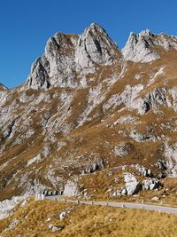 Scenic view of snowcapped mountains against clear sky