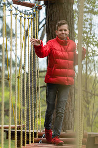 Portrait of smiling young man standing outdoors