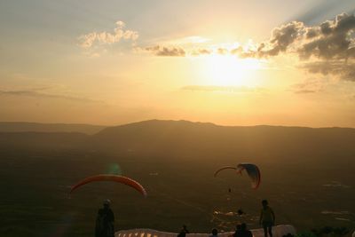 Scenic view of mountains against sky during sunset