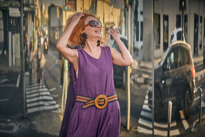 Young woman wearing sunglasses standing outdoors