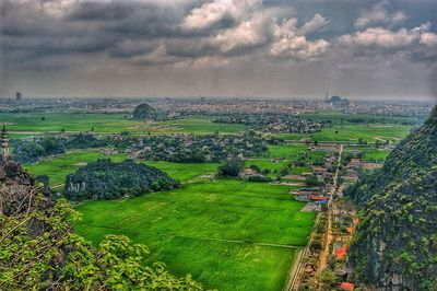 Aerial view of agricultural field against sky