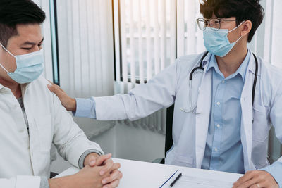 Female doctor examining patient at clinic