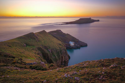 Scenic view of sea against sky during sunset