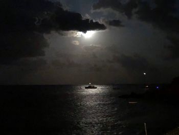 Scenic view of sea against sky at night