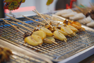 Close-up of meat on barbecue grill