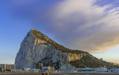 Panoramic view of sea and mountains against sky