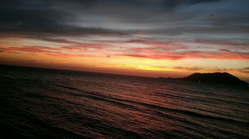 Scenic view of sea against sky at sunset