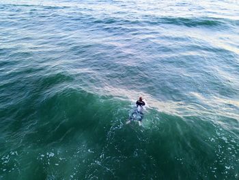 High angle view of man fishing in sea