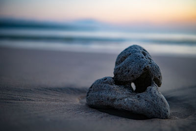 Close-up of sea against sky during sunset