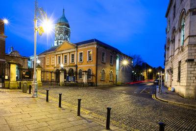 Buildings in city at night