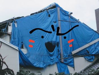 Low angle view of clothes drying against the sky