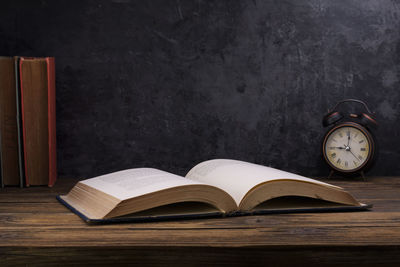 Open book on table at home