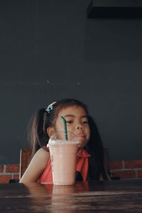 Portrait of a girl drinking glass