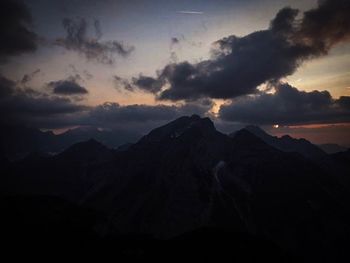 View of mountain range against cloudy sky