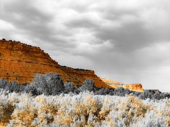 View of cliffs against cloudy sky