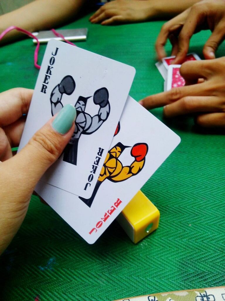 CLOSE-UP OF HANDS HOLDING BABY PLAYING