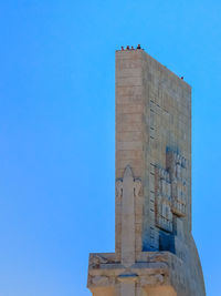 Low angle view of building against blue sky