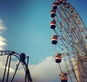 Low angle view of ferris wheel against sky