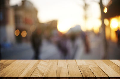 Defocused image of illuminated lights on table in city