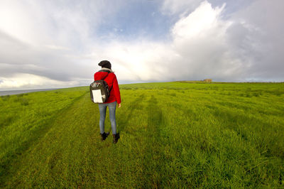 Rear view of man standing on field