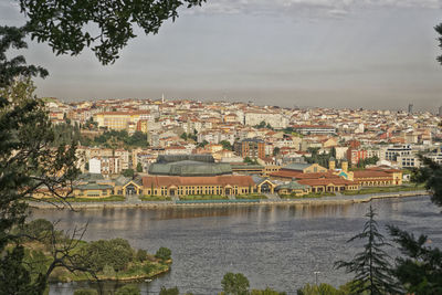 High angle view of river amidst buildings in town