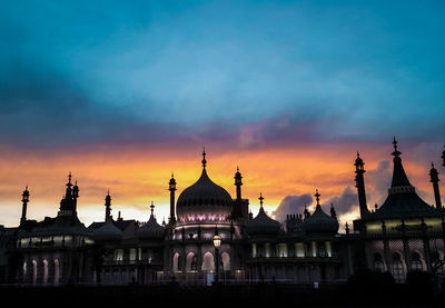 View of buildings against sky at sunset