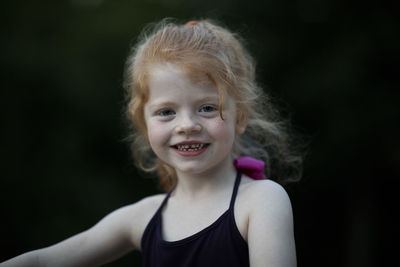 Portrait of cute smiling girl with blond hair