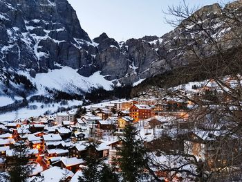 Panoramic view of mountain valley with a village during sunset