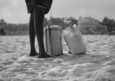 A tea seller taking a break on the vast beach.