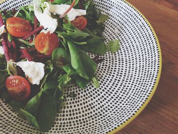 High angle view of chopped fruits in plate on table