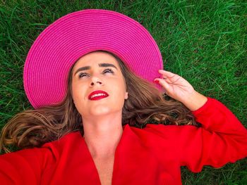 Portrait of young woman in pink hat