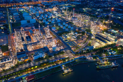 High angle view of city lit up at night