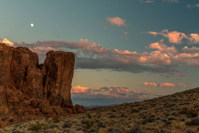 Scenic view of rocky mountains against sky during sunset