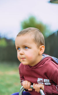 Portrait of cute boy looking away