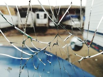 Close-up of broken glass window