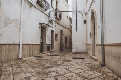 Footpath amidst buildings