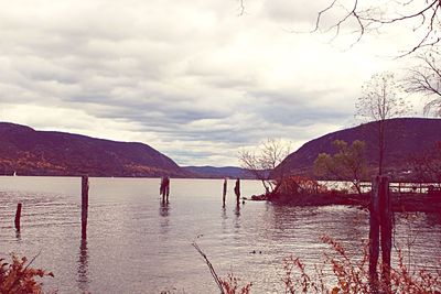 Scenic view of lake against cloudy sky