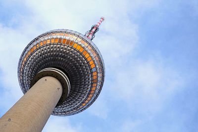 Low angle view of tower against cloudy sky