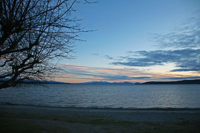 Scenic view of sea against sky at sunset