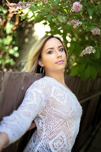 Portrait of beautiful woman standing in park