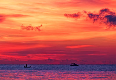 Scenic view of sea against orange sky