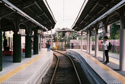 People at railroad station